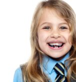Child smiling during Phase 1 treatment West Hempstead