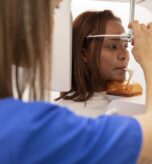 Patient undergoing CBCT scan at an orthodontic clinic in West Hempstead